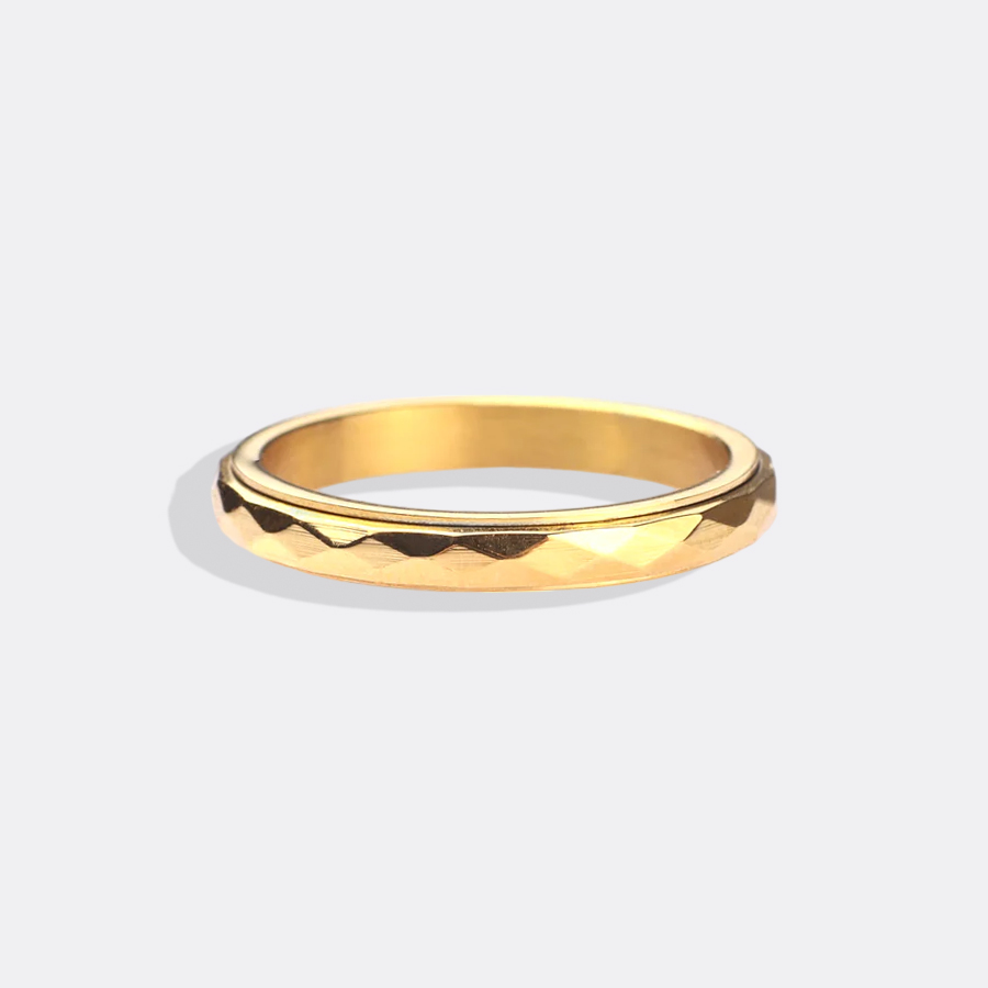 Delikat hamret snurrende fidget-ring