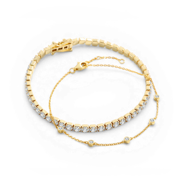 Duo: armband med infattad sten och tennisarmband guld