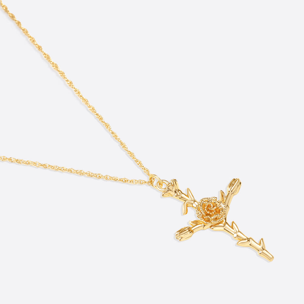 Halsband med blomsterkorshänge
