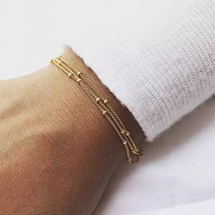 Tredubbelt armband med satellitkedja