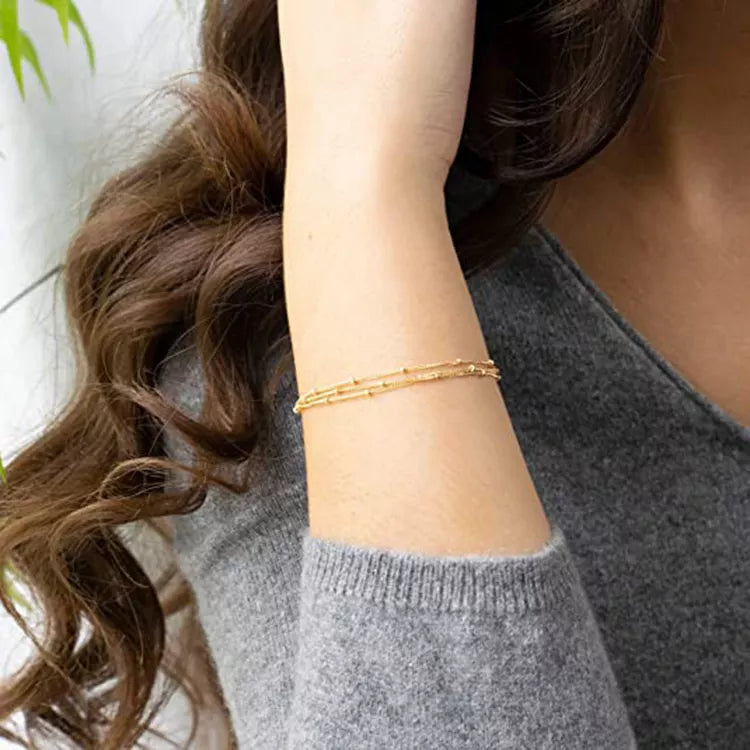 Tredubbelt armband med satellitkedja