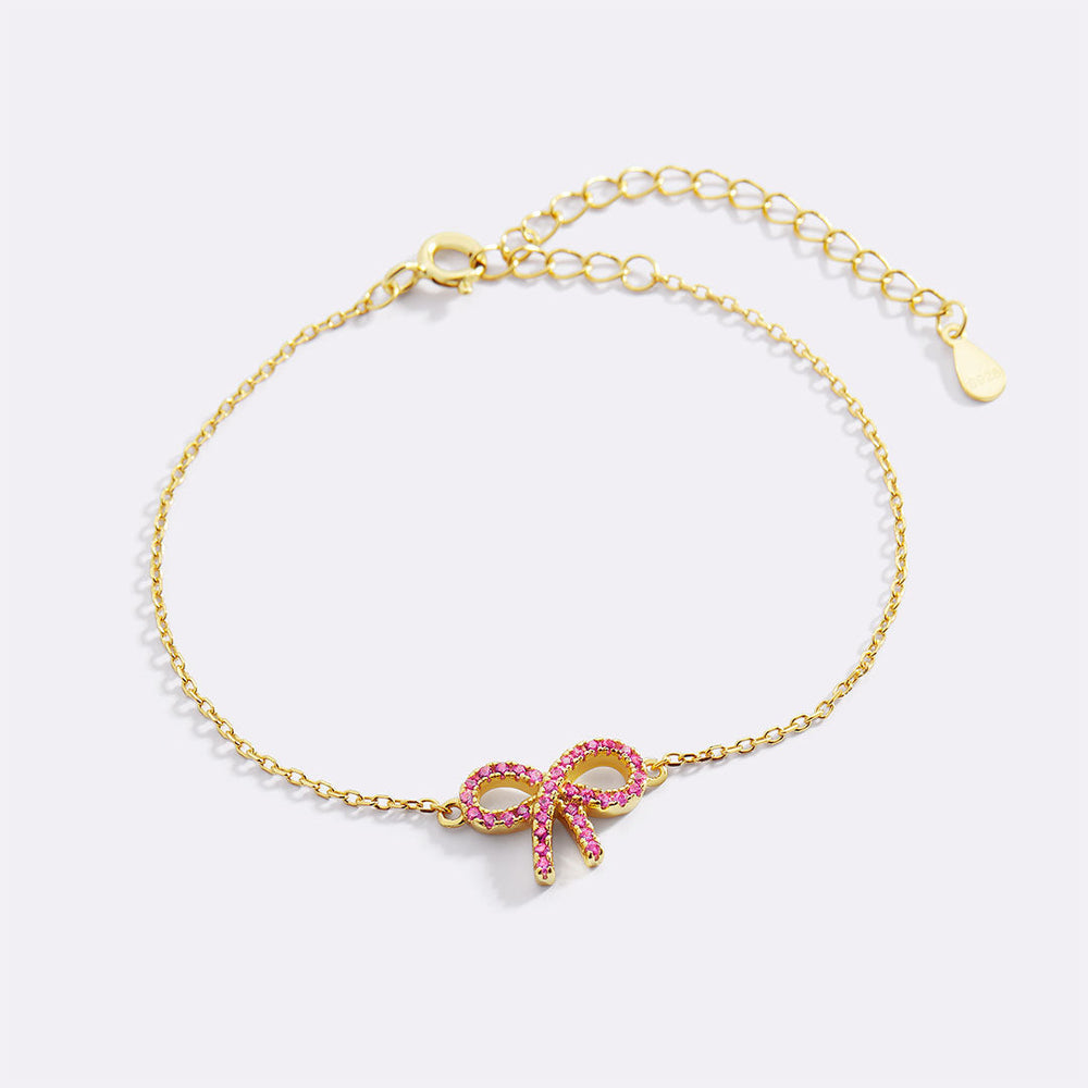Rosa pavéarmband med rosett