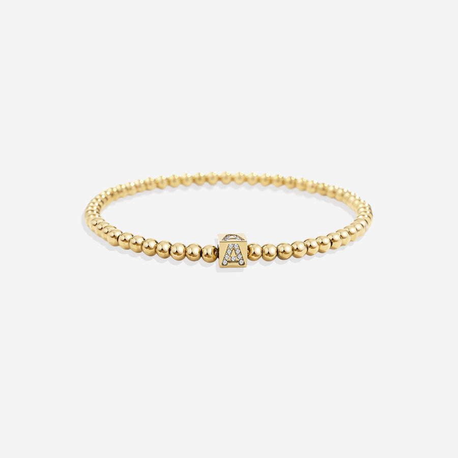 Pärlat armband med blockinitial guld