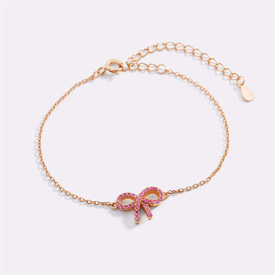 Rosa pavéarmband med rosett