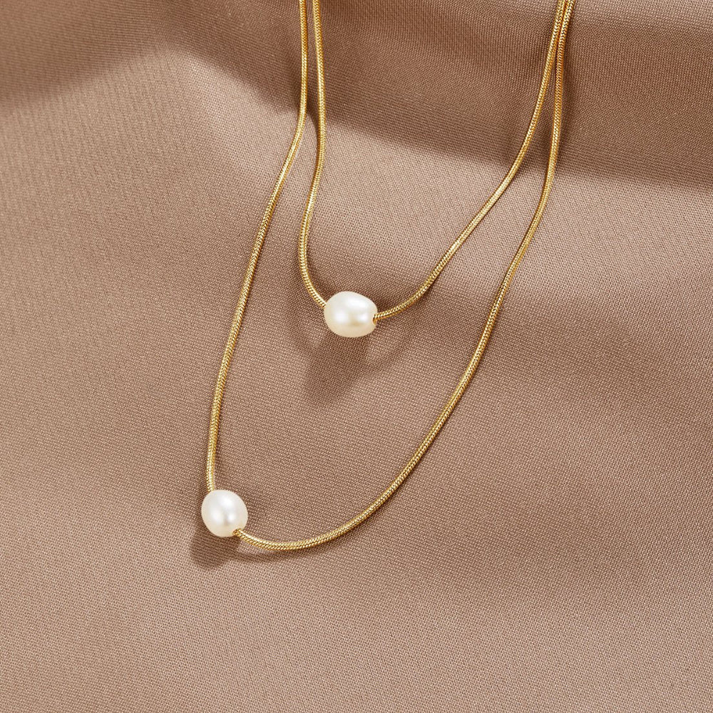 Lagrat halsband med sötvattenspärlor guld – bild 2