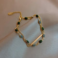 Dobbelt armbånd med jadesteiner og charm