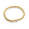 Bracelet perles dorées à cœur pavé