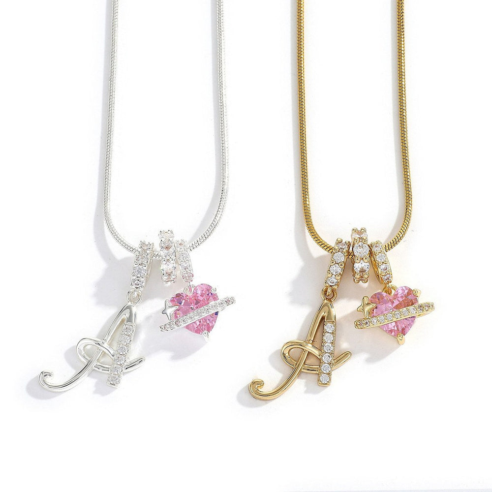 Saturn initialhalsband med hjärta, i silver- och guldfärg