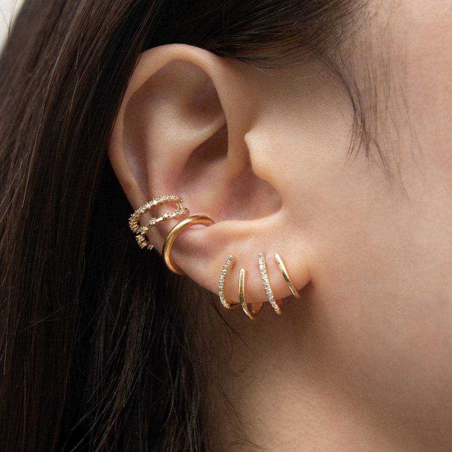 Gullfargede Griffe øredobber, nærbilde på øret