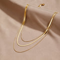 Halsband med flera kedjor guld