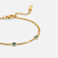 Athena lagdelt armbånd med blå krystall