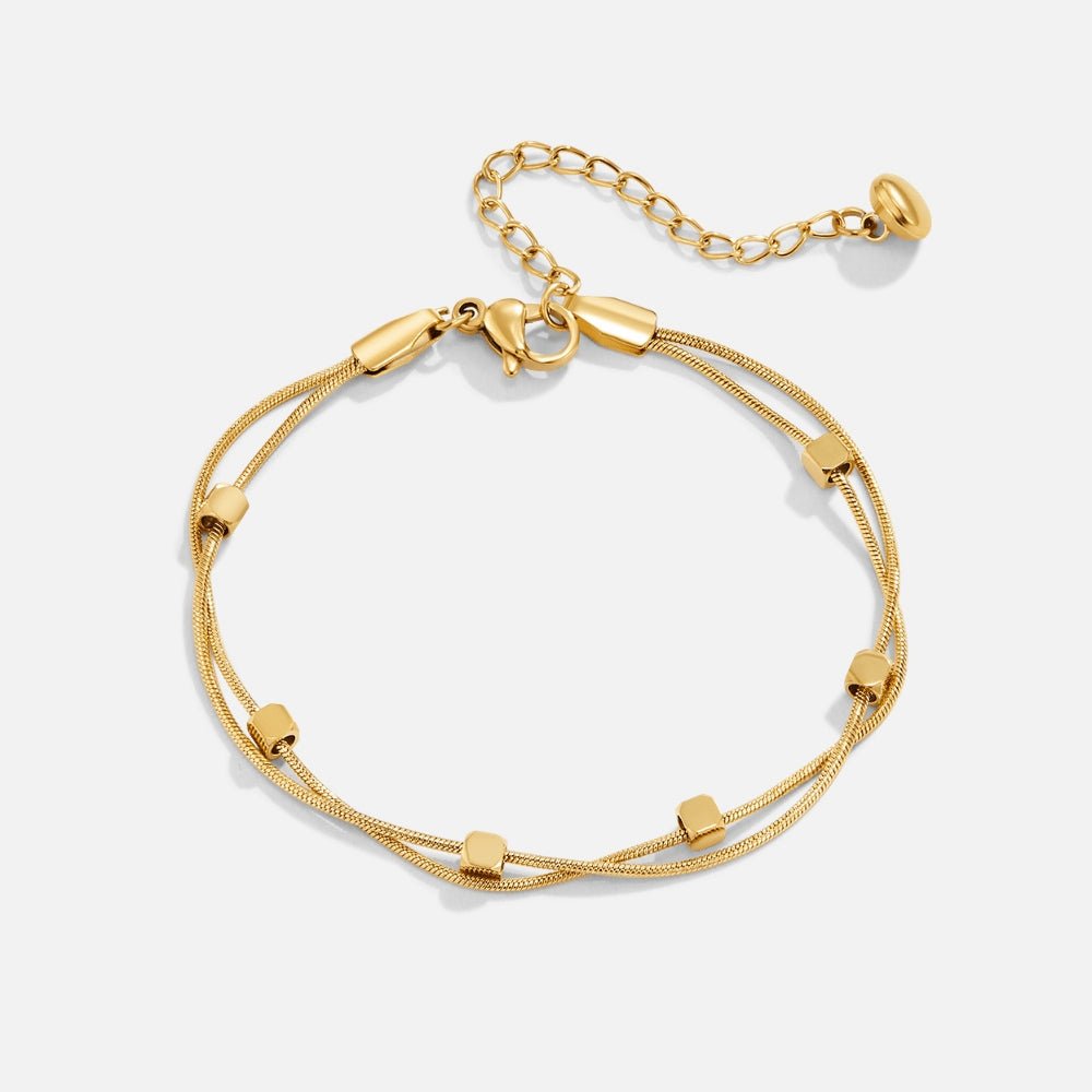 Mia gullfarget lagdelt armbånd med kuber
