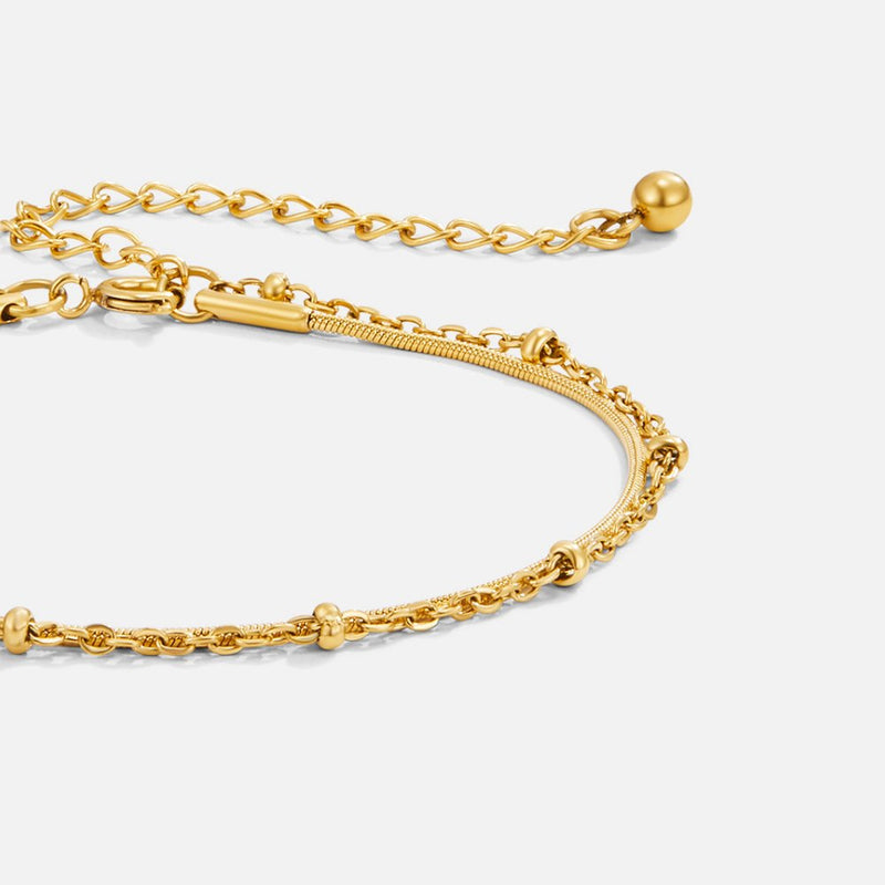 Pia guldfärgat lagerat armband